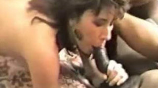 Sultry MILF Brunette Sucking A Black Shaft