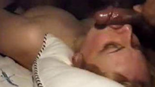 Attractive Plump Woman Blowing Two Black Pricks