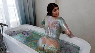 Busty latina takes a glitter bath before fucking