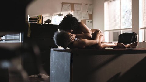 Two passionate black bitches fucking in the office